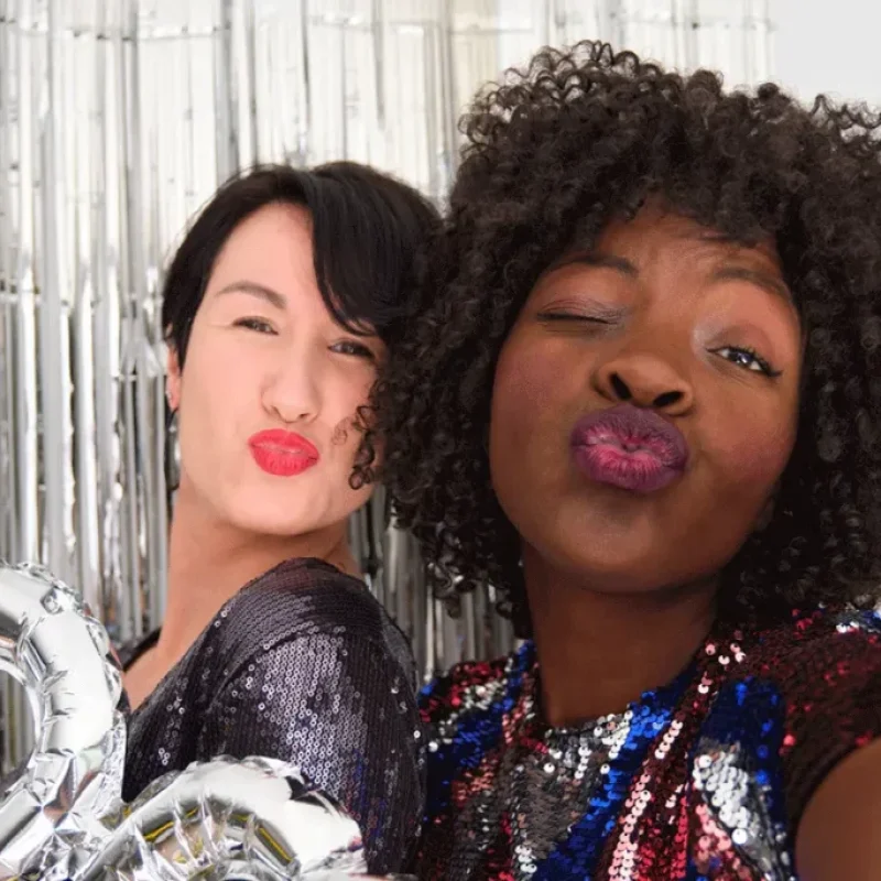 two-multiracial-women-in-a-party-with-a-party-silv-2023-11-27-05-21-26-utc