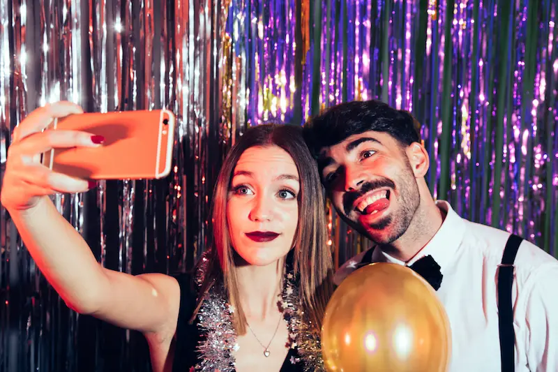 happy-couple-taking-selfie-new-years-party